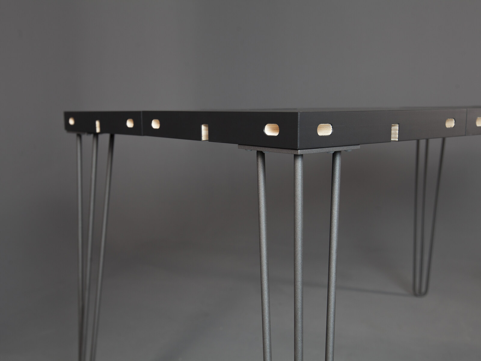 Modular on slender steel legs, showing the joints between modules