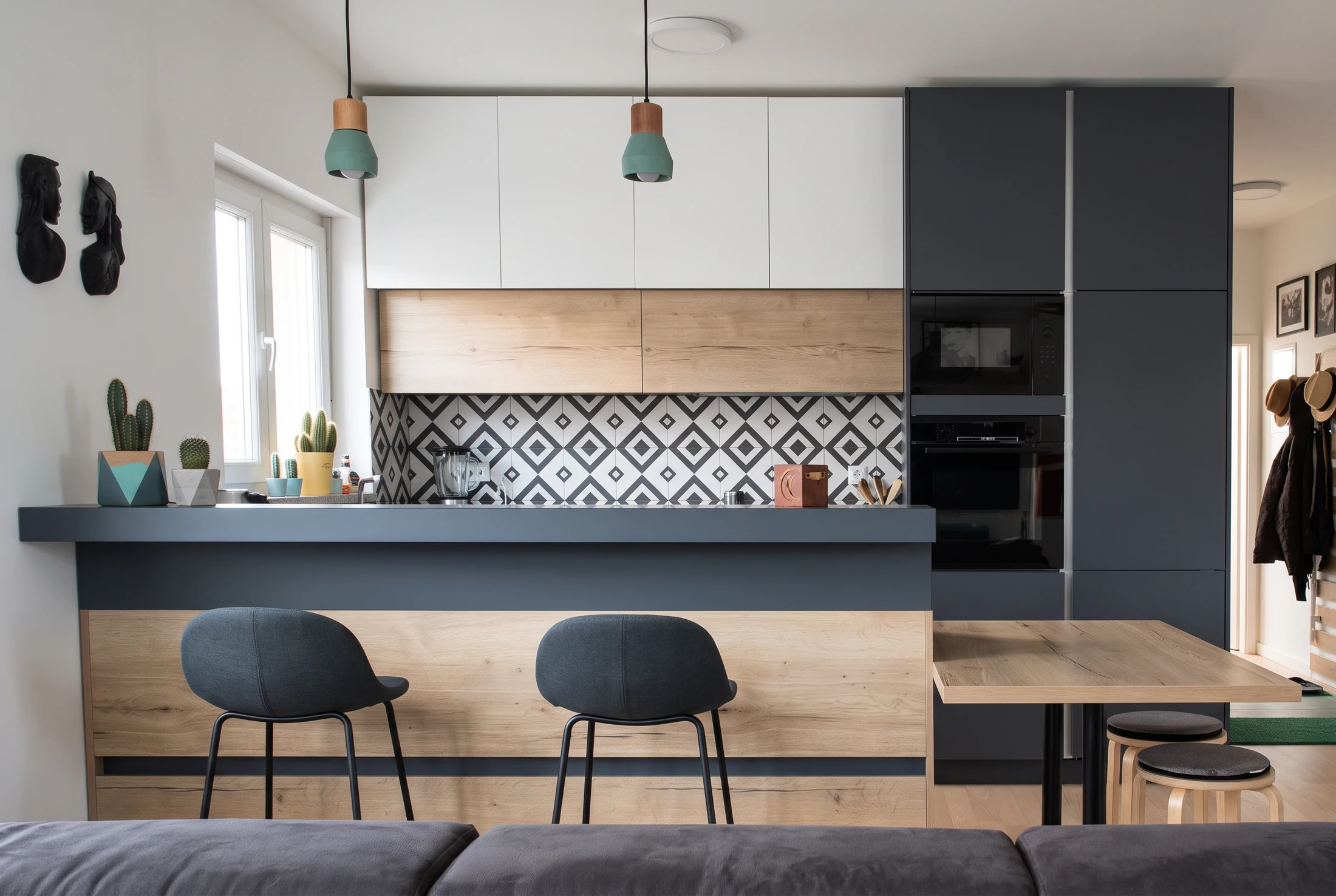 Custom oak and graphite kitchen with an island and dining extension